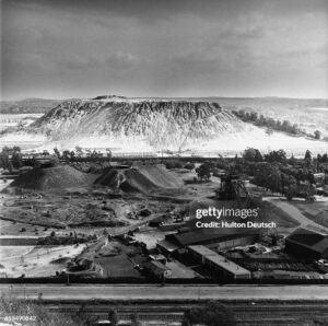 The Witwatersrand, or Rand, is a ridge of auriferous rock which stretches for some 100 kilometers between the Vaal and Olifants Rivers, in northeast South Africa.